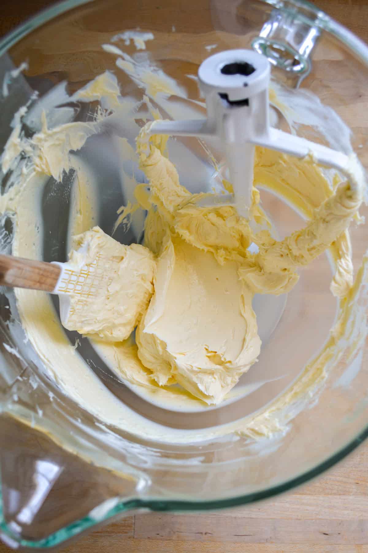 Creamed vegan butter in the bowl of a stand mixer.