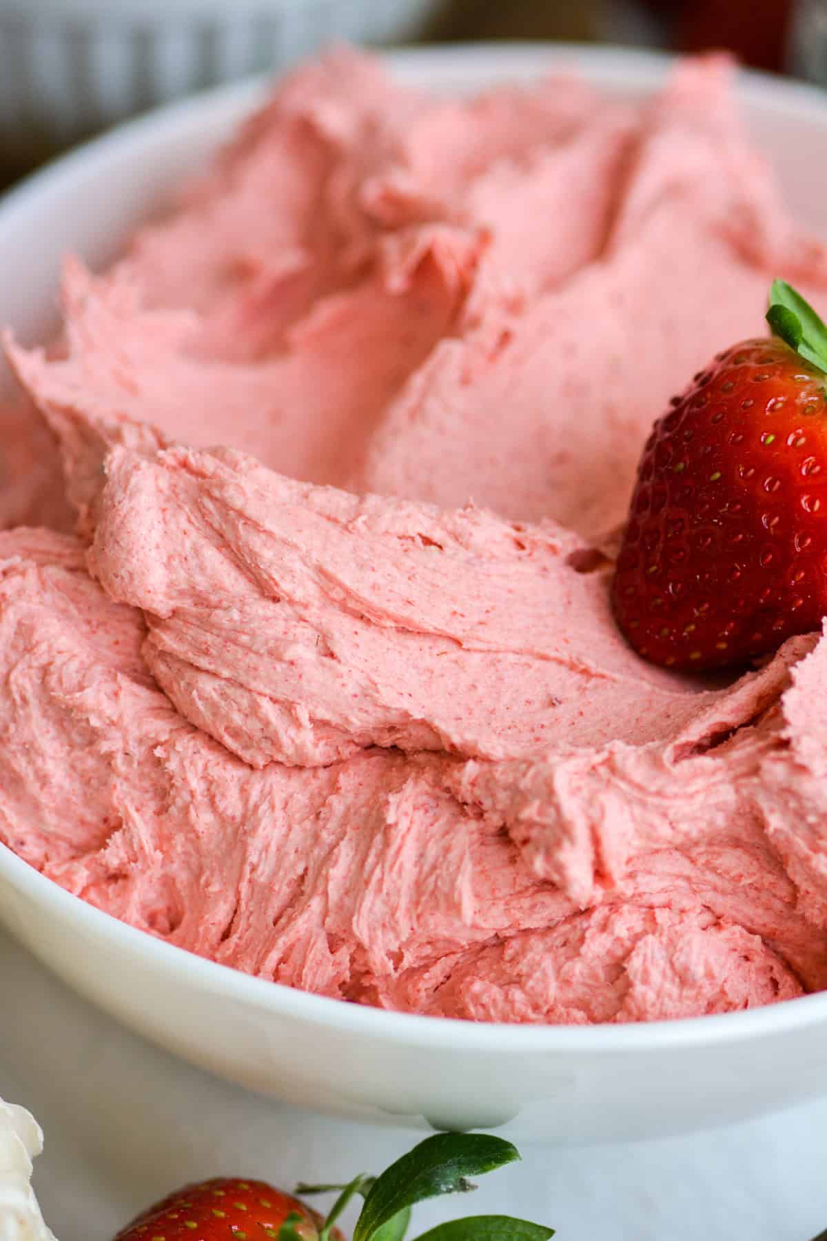 Vegan Strawberry Frosting in a white bowl.