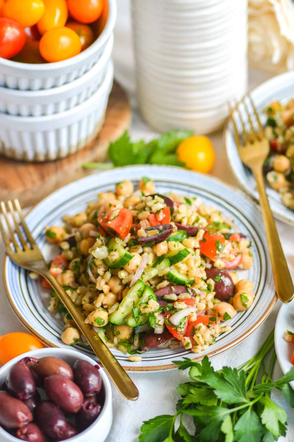 Barley Salad on a plate with a gold fork.