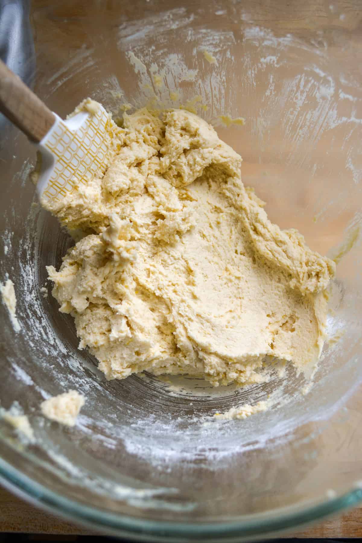 Lemon Cookie Bar dough in the bowl of a stand mixer.