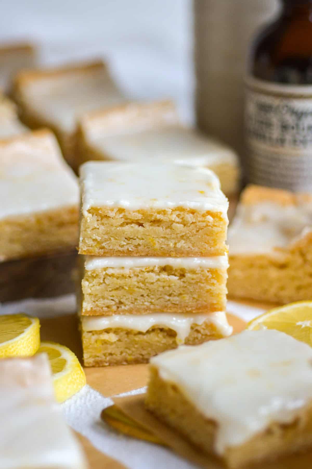 Three Lemon Cookie Bars stacked on top of each other.