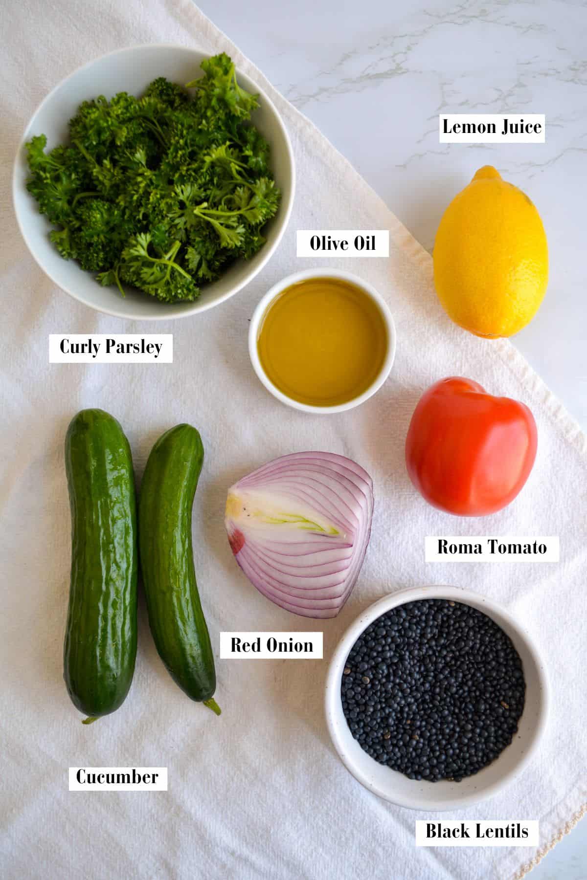 Ingredients for this recipe in small bowls on a linen surface.