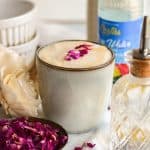 Rose Water Latte in a mug on a linen surface.