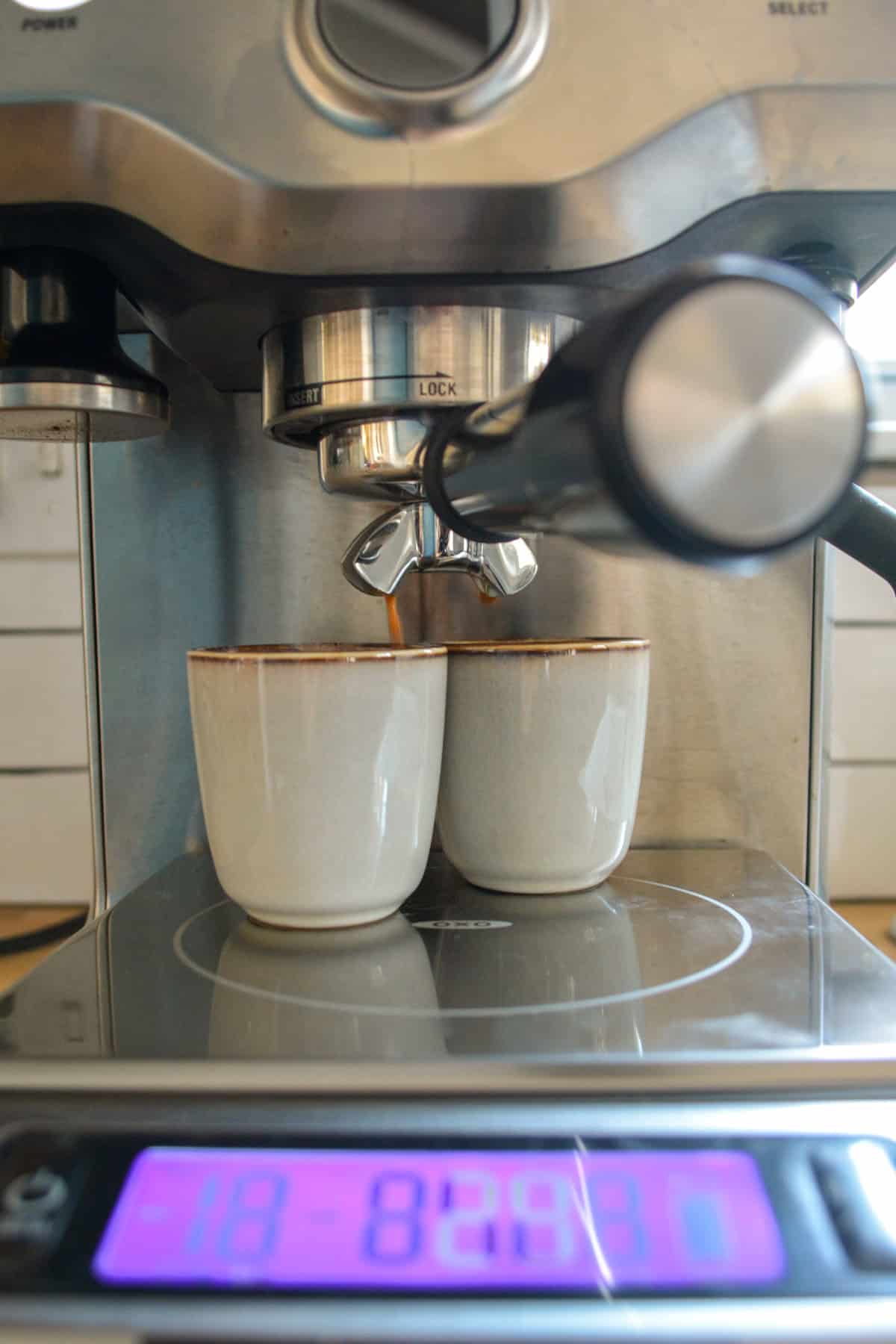 Pulling two shots of espresso with an espresso machine.