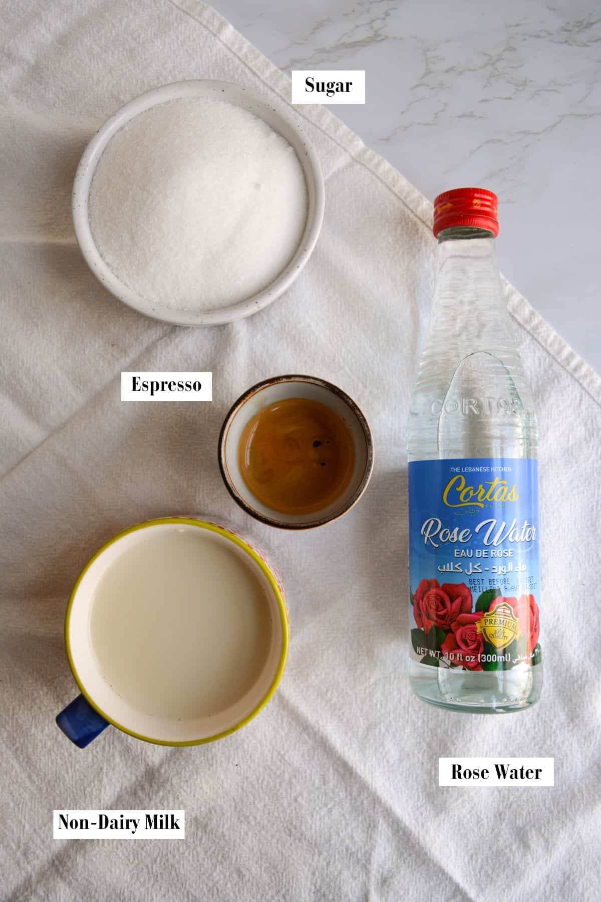 Ingredients for this recipe in small bowls on a linen surface.
