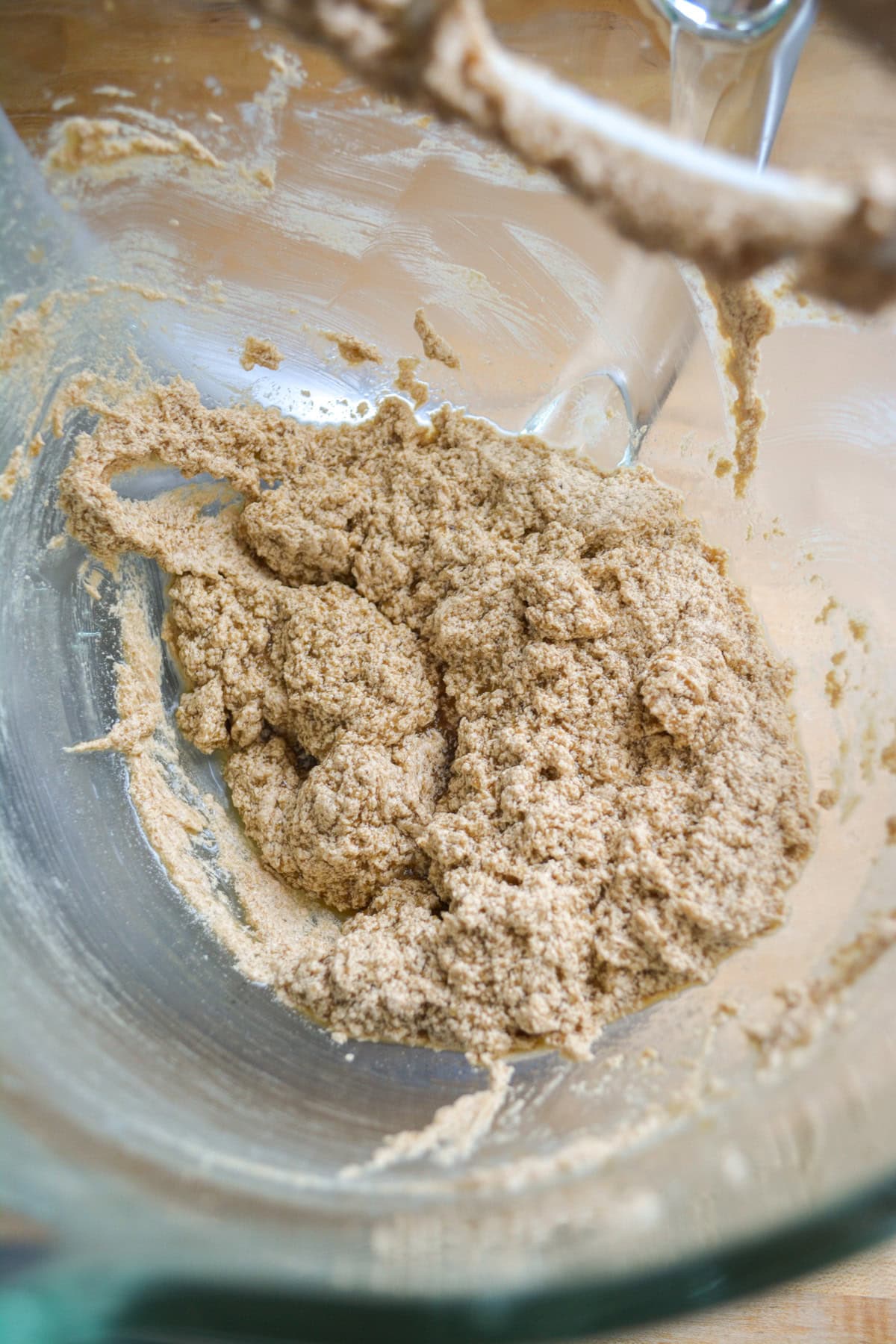 Non-dairy milk and vanilla added to the bowl.