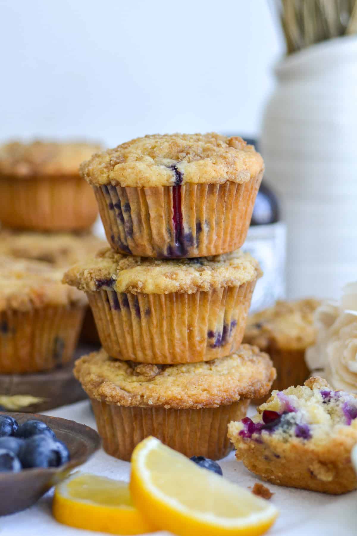3 Vegan Blueberry Muffins stacked on top of each other.