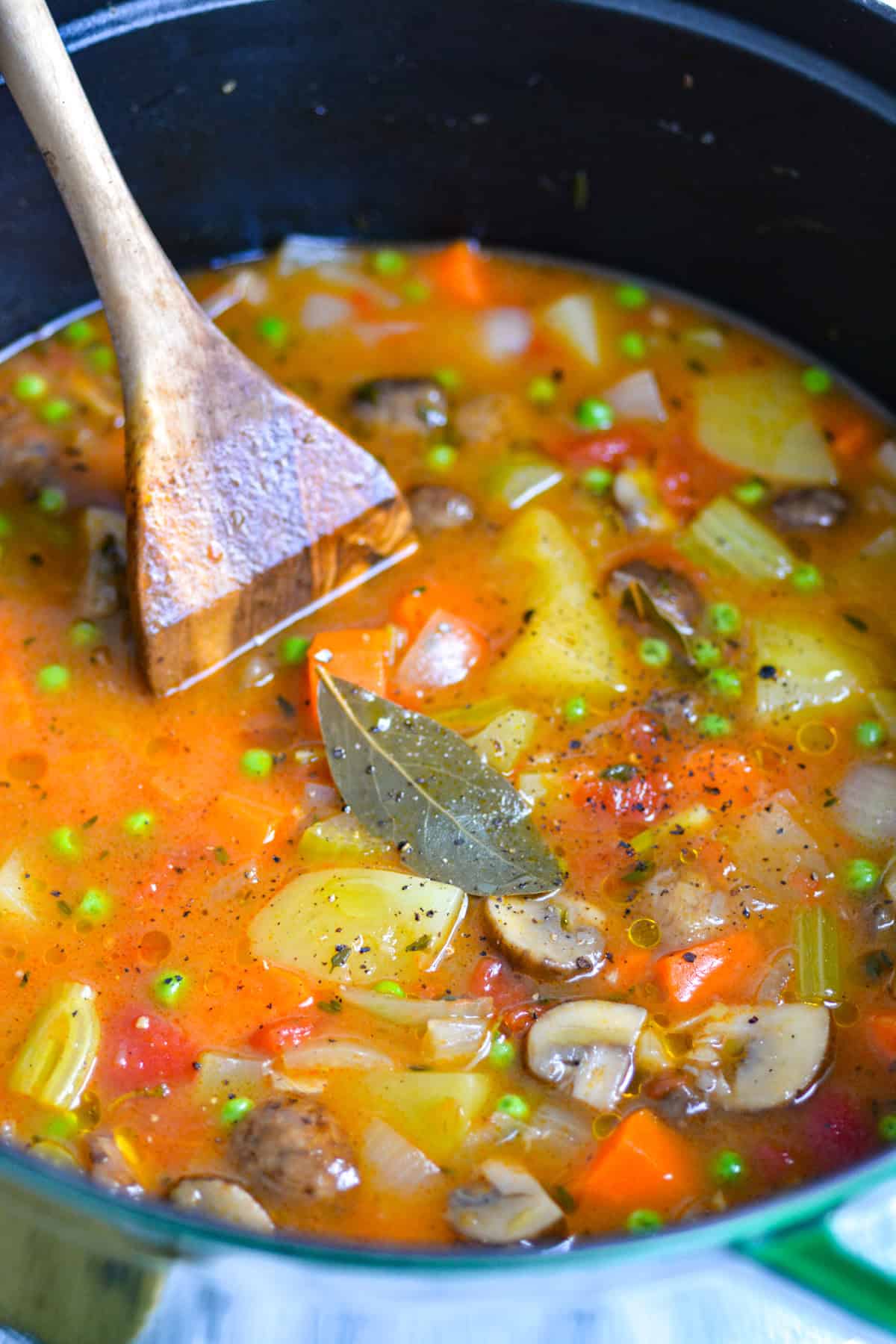 A pot of Vegetable Stew with a bay leaf on top.