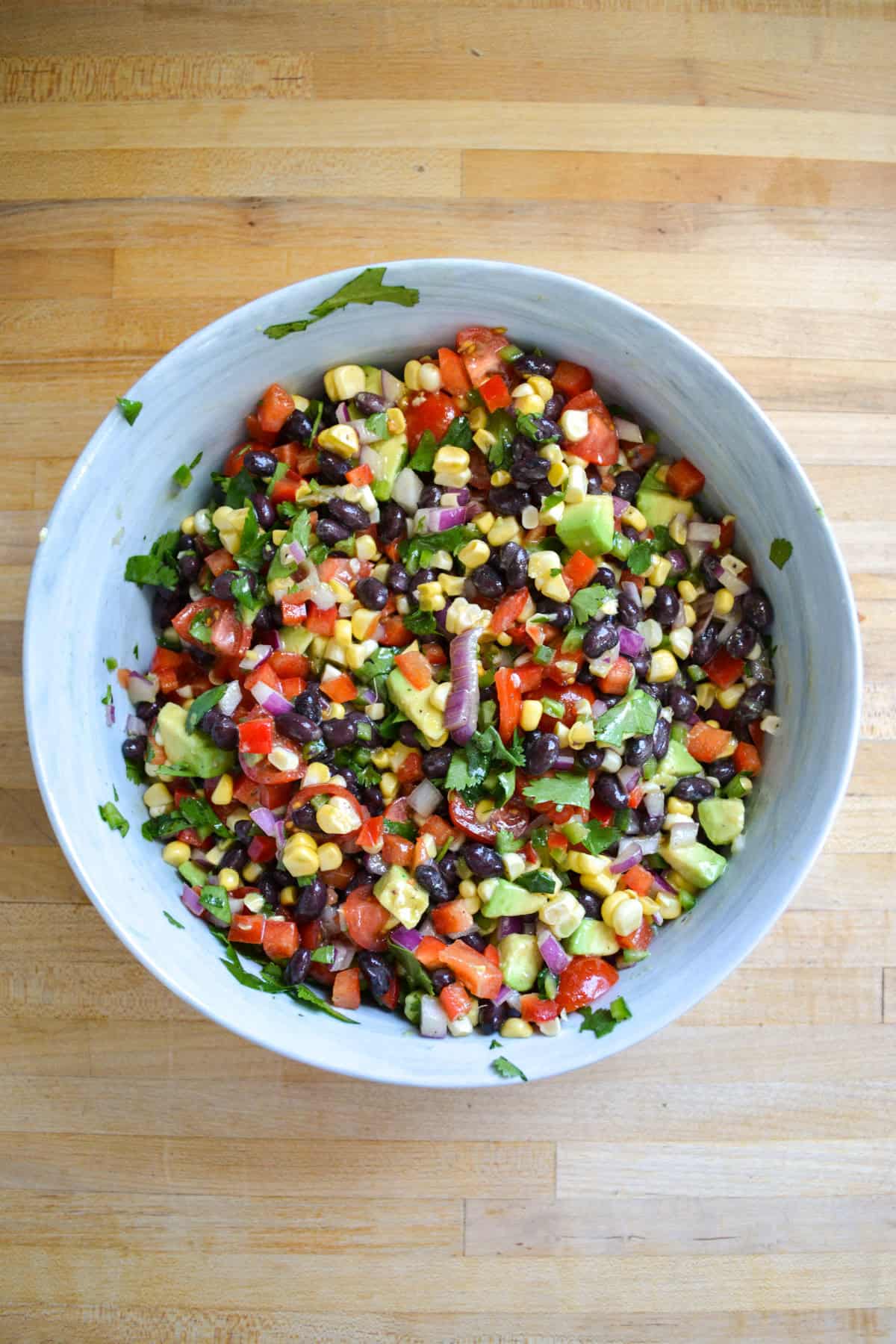 Black Bean Corn Salad with Avocado mixed together in a large bowl.