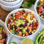 Black Bean Corn Salad in a bowl on a linen surface.