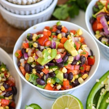 Black Bean Corn Salad in a bowl on a linen surface.
