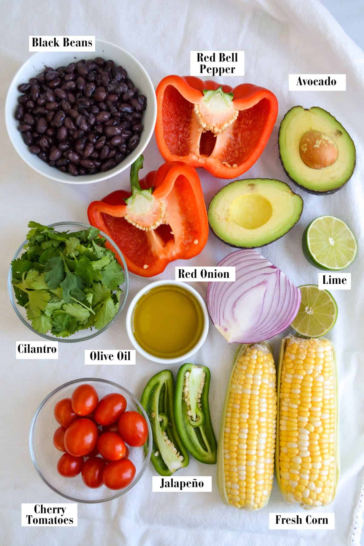 Ingredients for making this recipe in small bowls on a linen surface.