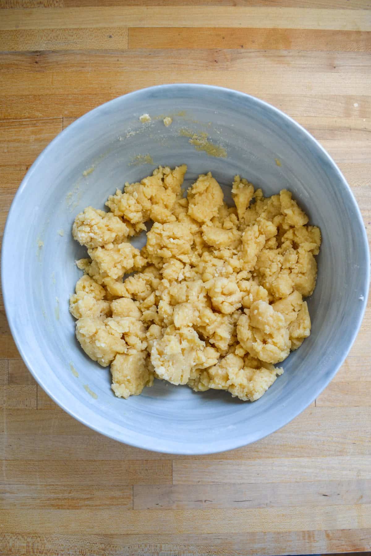 Crumble dough in a large mixing bowl.