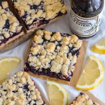 Blueberry Crumble Bars on a linen surface.