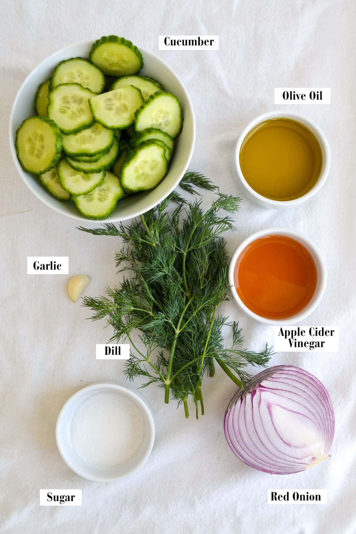 Ingredients for this recipe in small bowls on a linen surface.