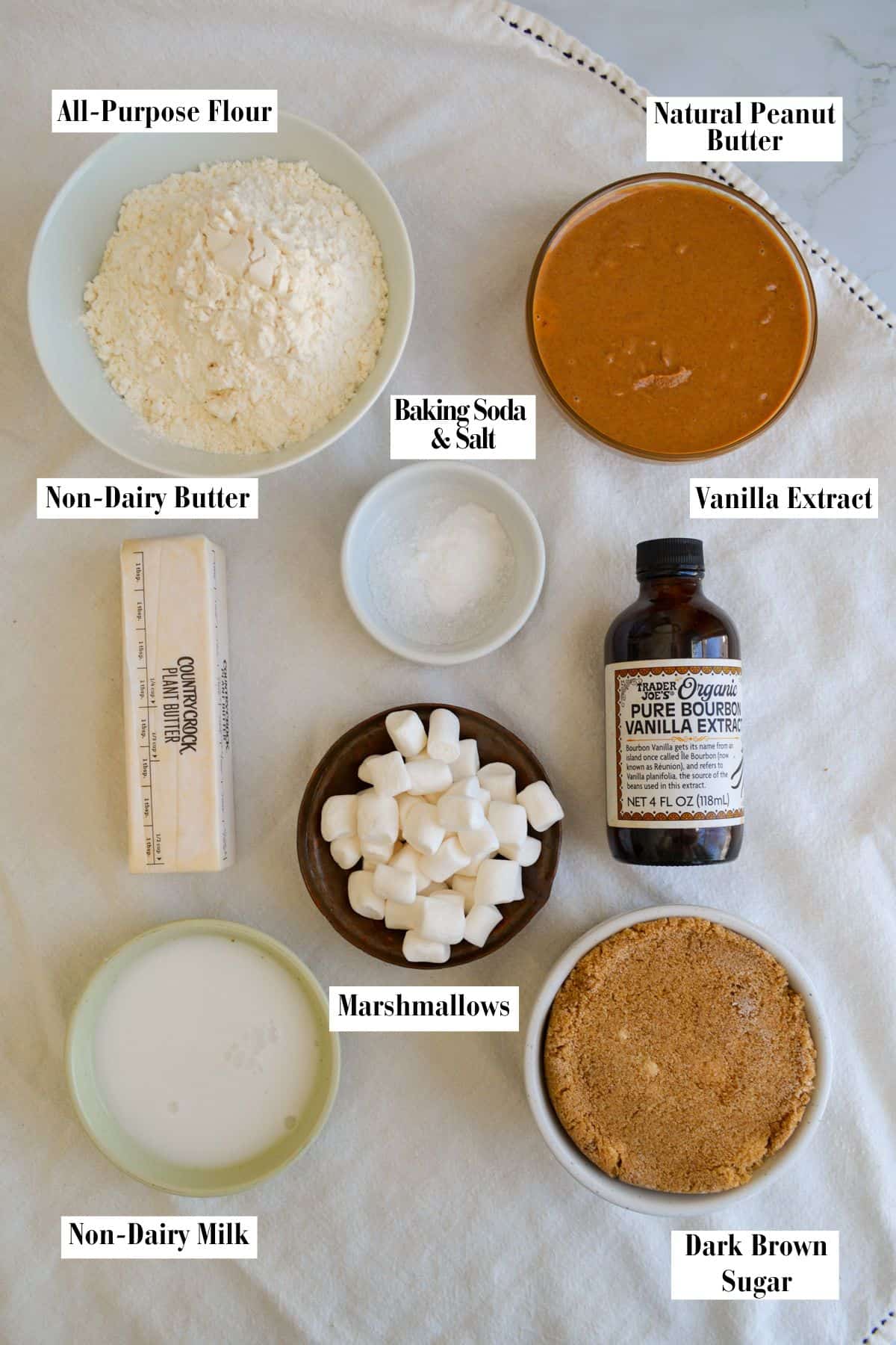 Ingredients for this recipe in small bowls on a linen surface.