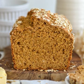 A loaf of Irish Brown Bread on a wooden board.