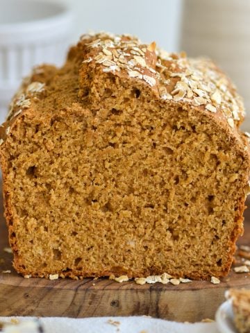 A loaf of Irish Brown Bread on a wooden board.