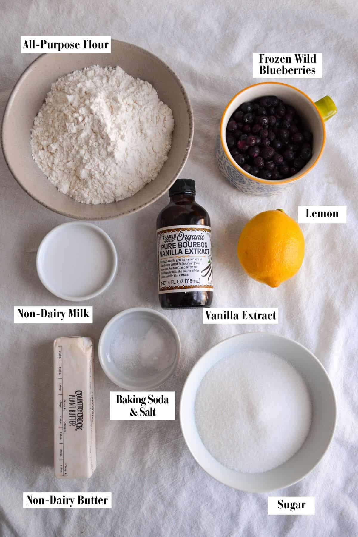 Ingredient for this recipe in small bowls on a linen surface.