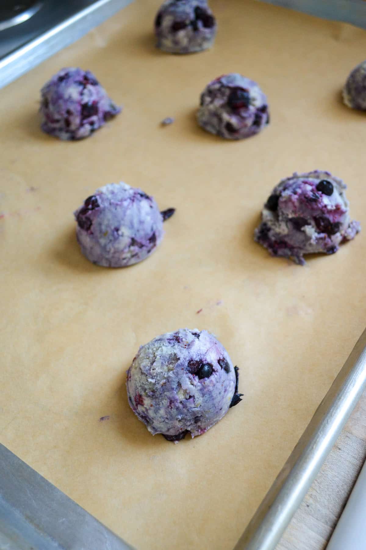 Scooped Blueberry Lemon Cookies on a baking sheet.