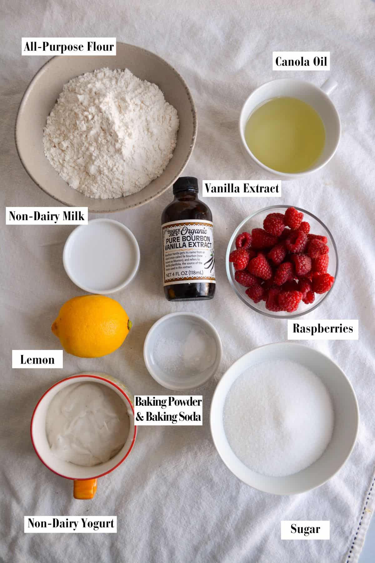 Ingredients for making this recipe in small bowls on a linen surface.