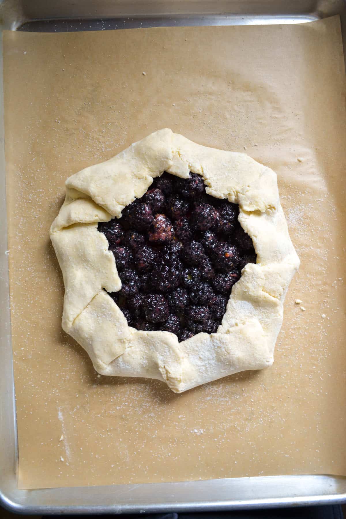Blackberry galette on a baking sheet ready to bake.