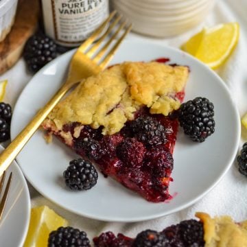 A slice of blackberry Galette on a small plate.