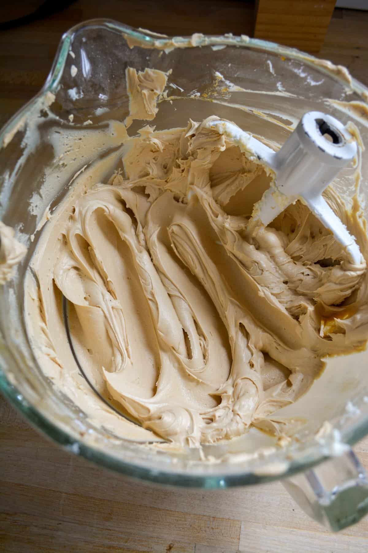 Espresso frosting in a glass bowl.