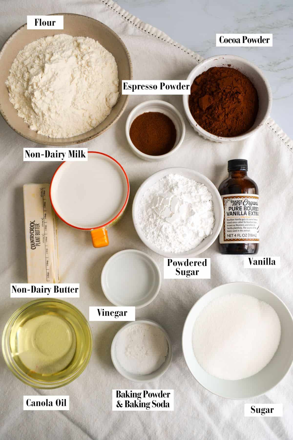 Ingredients for this recipe in small bowls on a wooden surface.