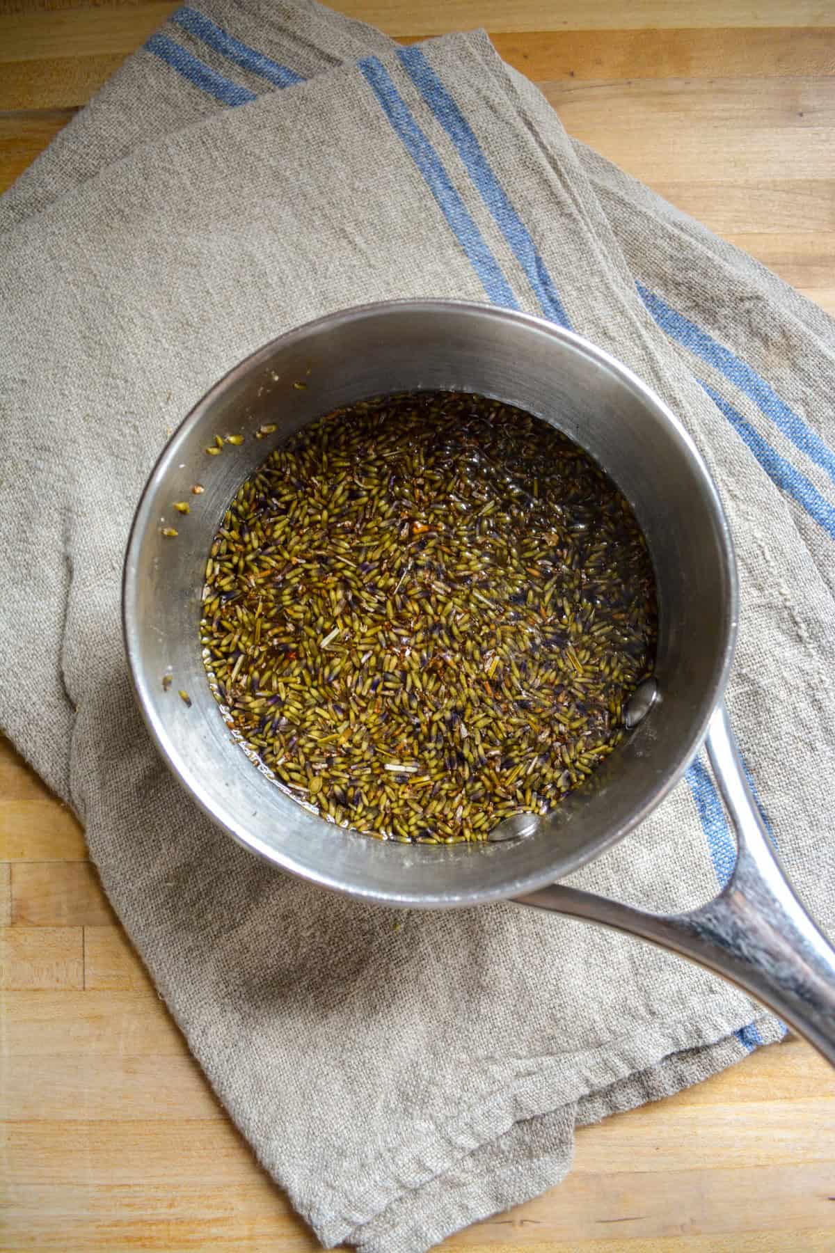 Lavender flowers steeping in simple syrup.
