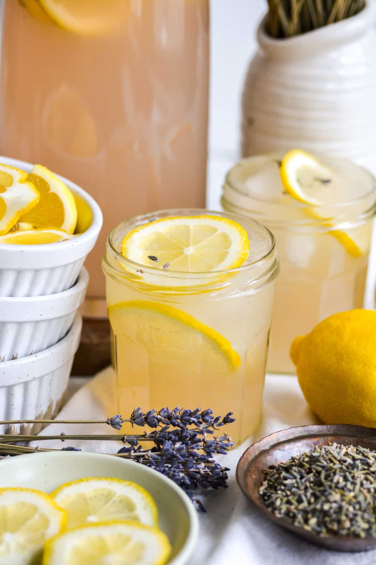 Lavender Lemonade in a glass with lemon slices in the glass.