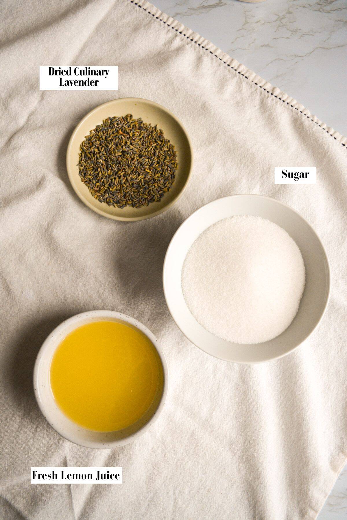 Ingredients for this recipe in small bowls on a linen surface.
