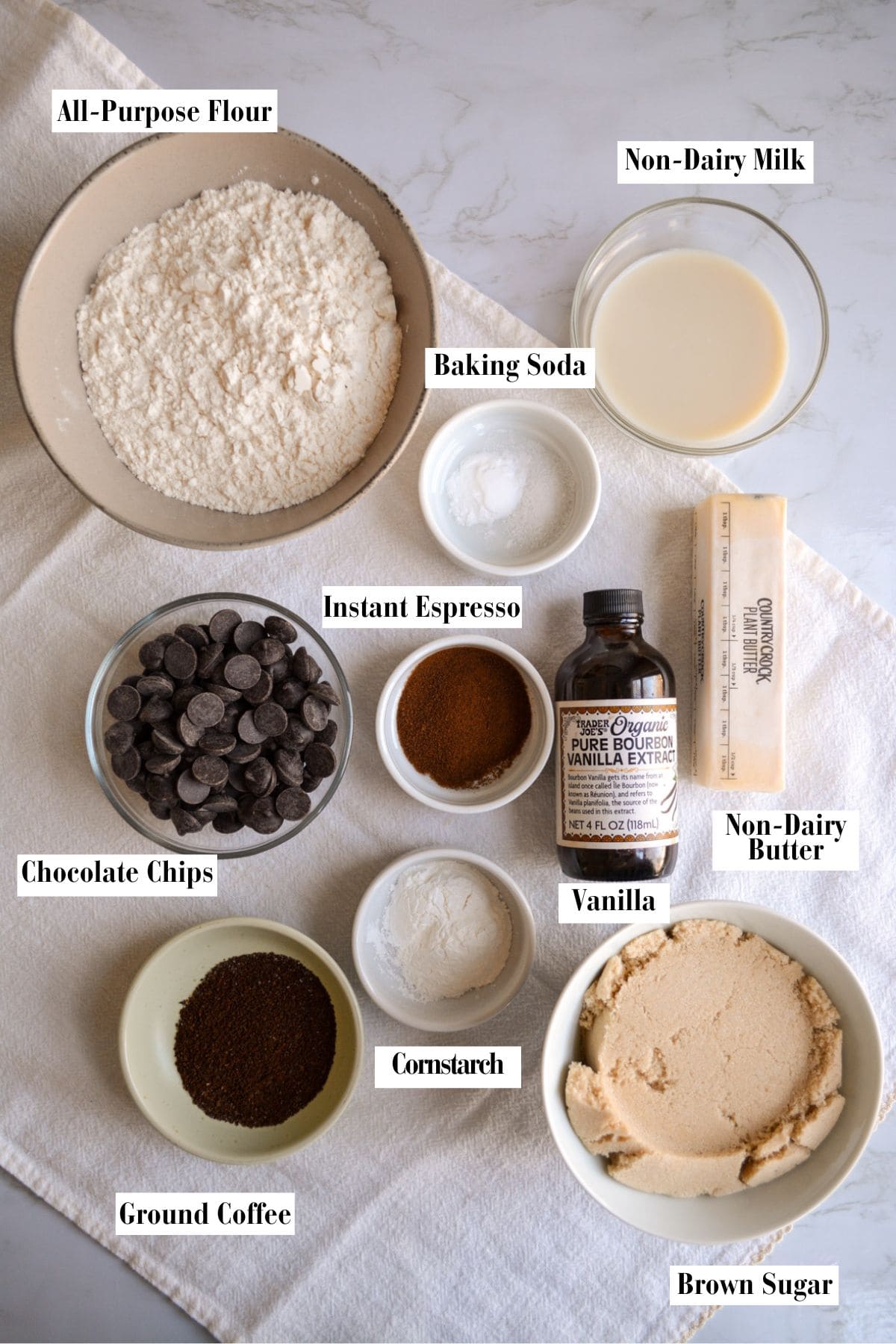 Ingredients for this recipe in small bowls on a linen surface.