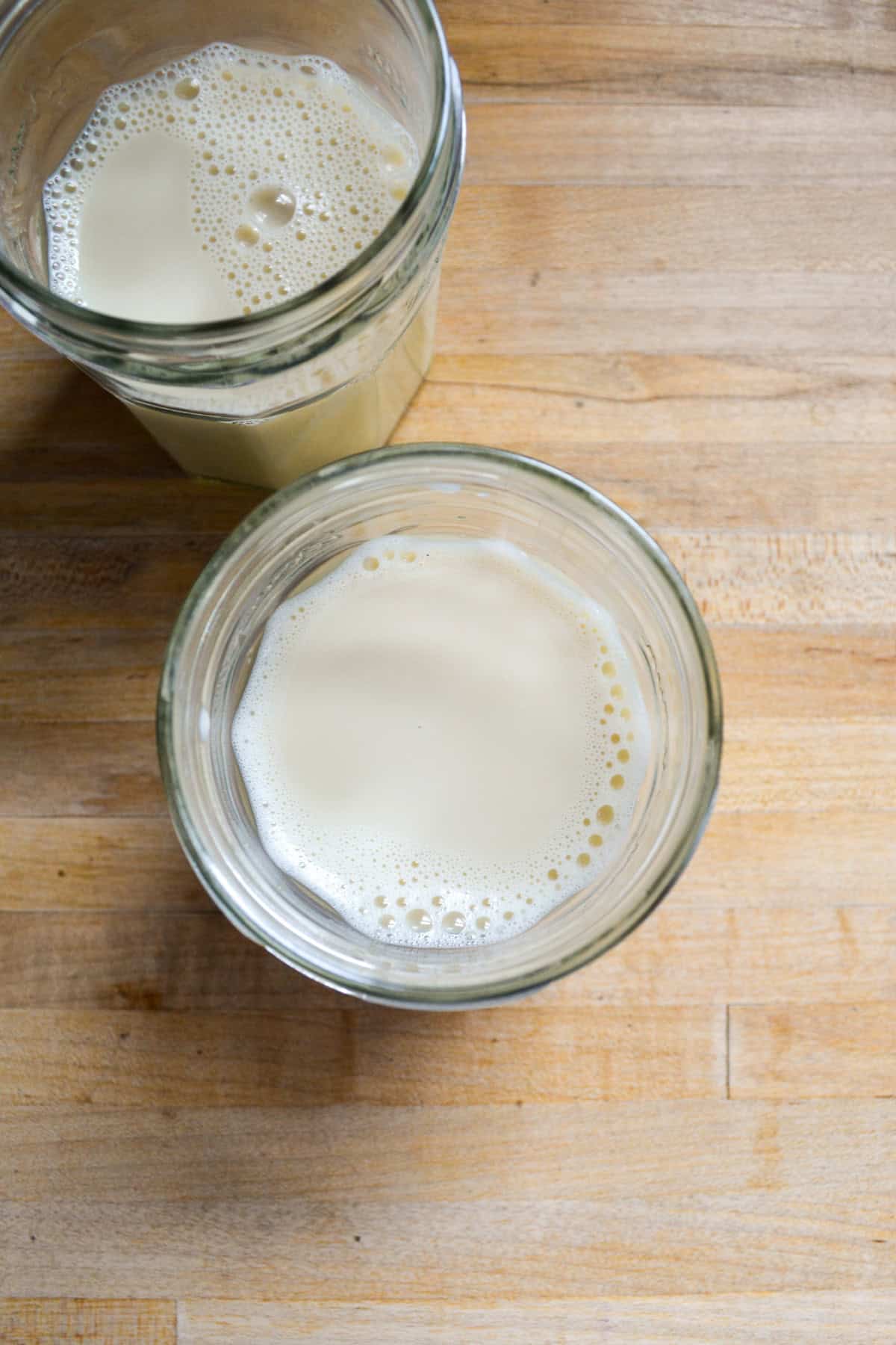 Milk and cardamom syrup in a glass.