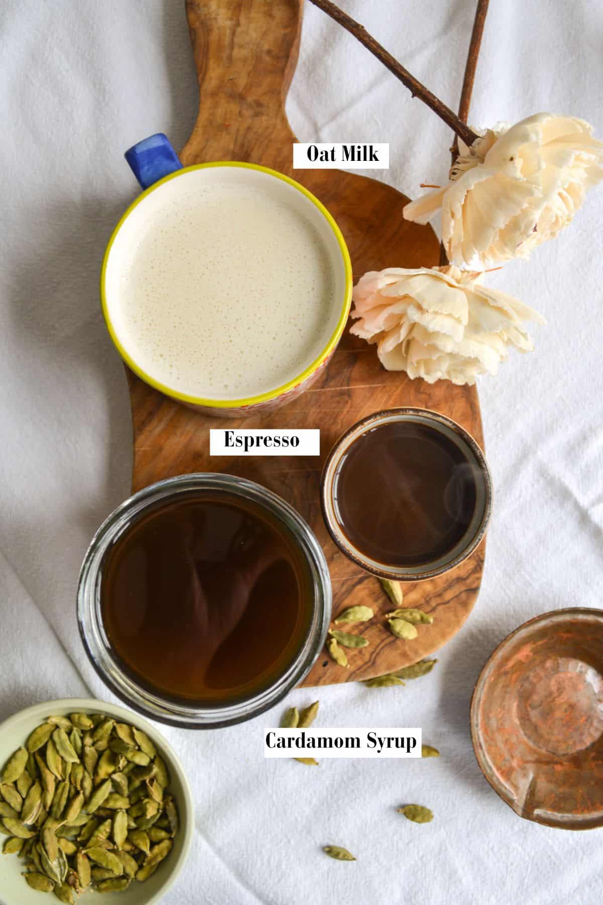Ingredients for this recipe in small bowls on a wooden board.