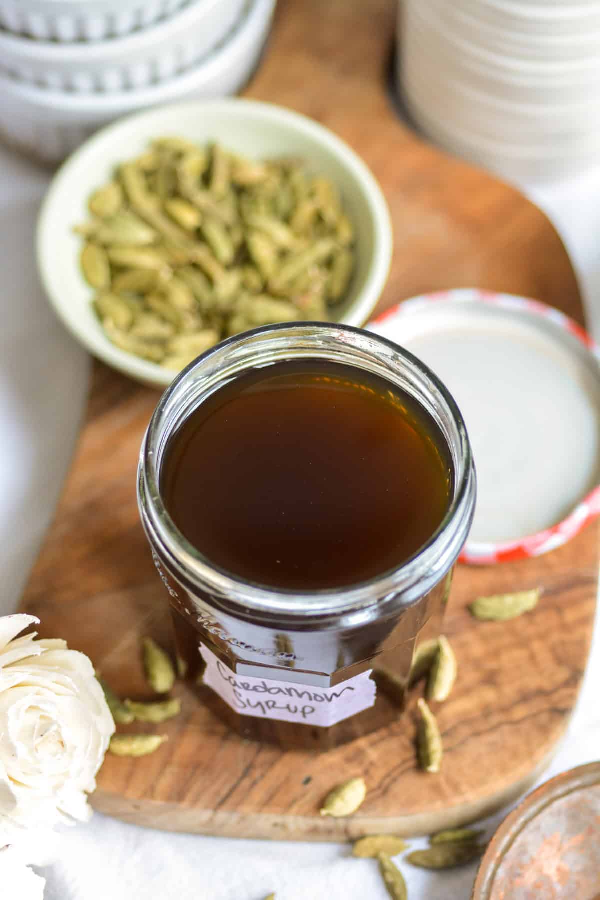 Cardamom syrup in a jar.