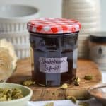 Cardamom syrup in a jar with a label on it.