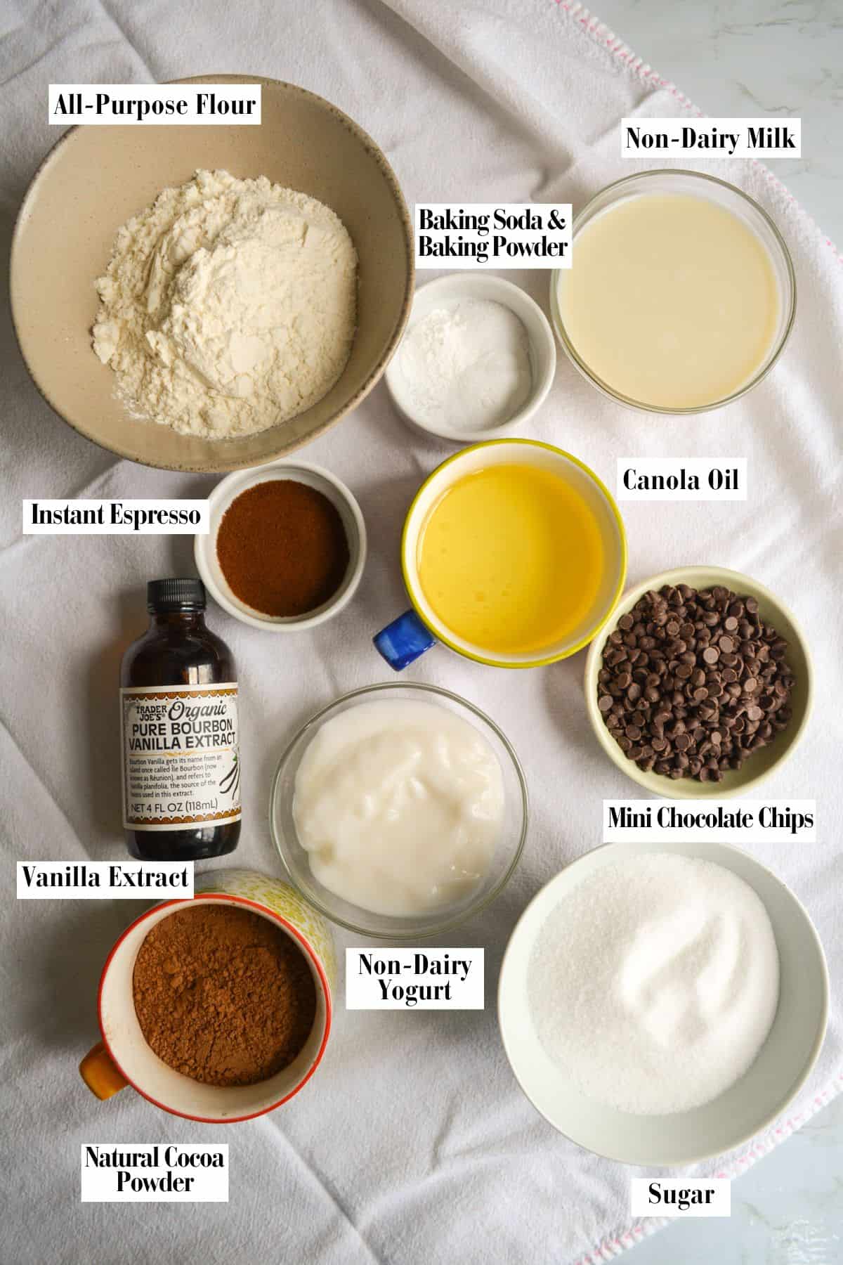 Ingredients for this recipe in small bowls on a linen surface.