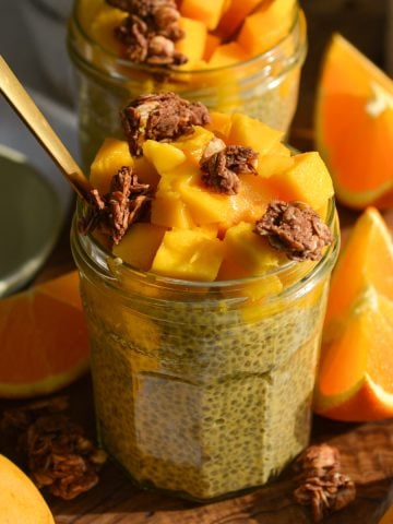 Mango Chia Seed Pudding in a glass jar topped with mango chunks.