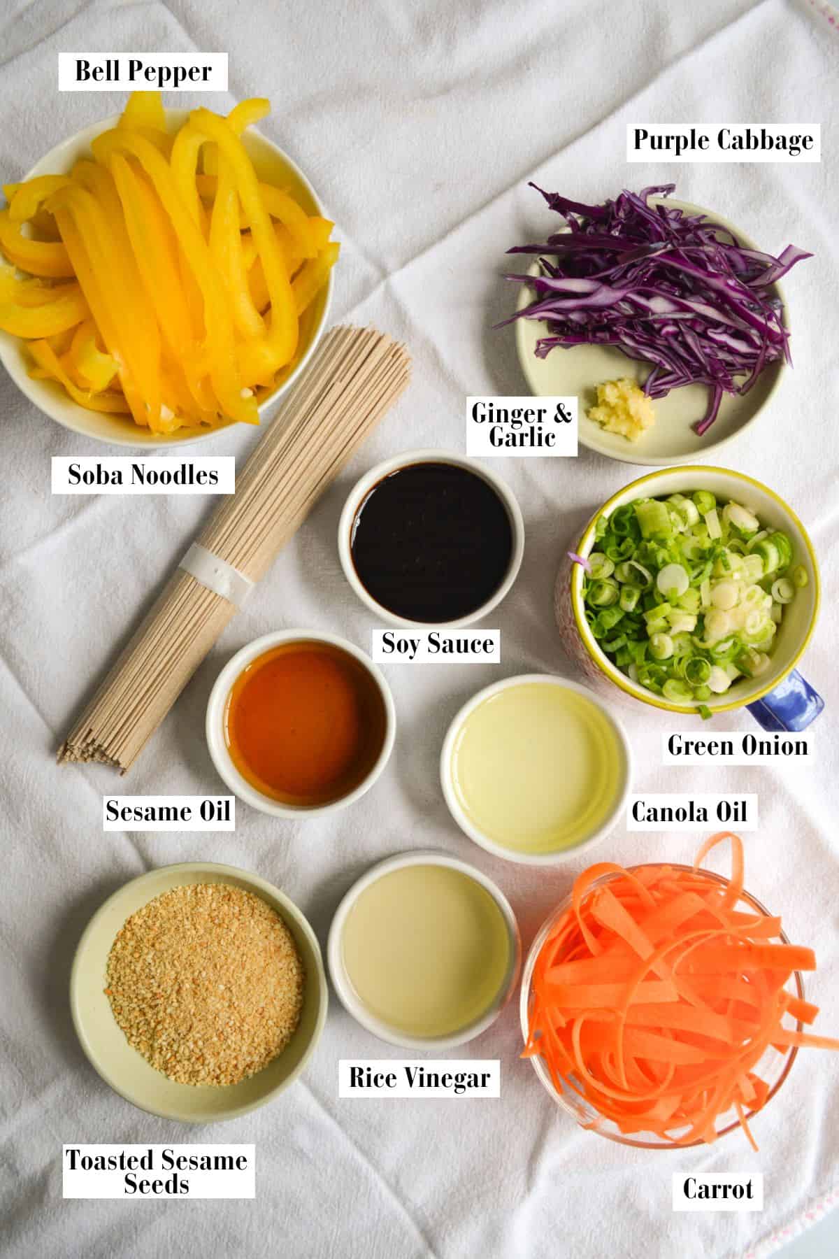 Ingredients for making this recipe in small bowls on a linen surface.
