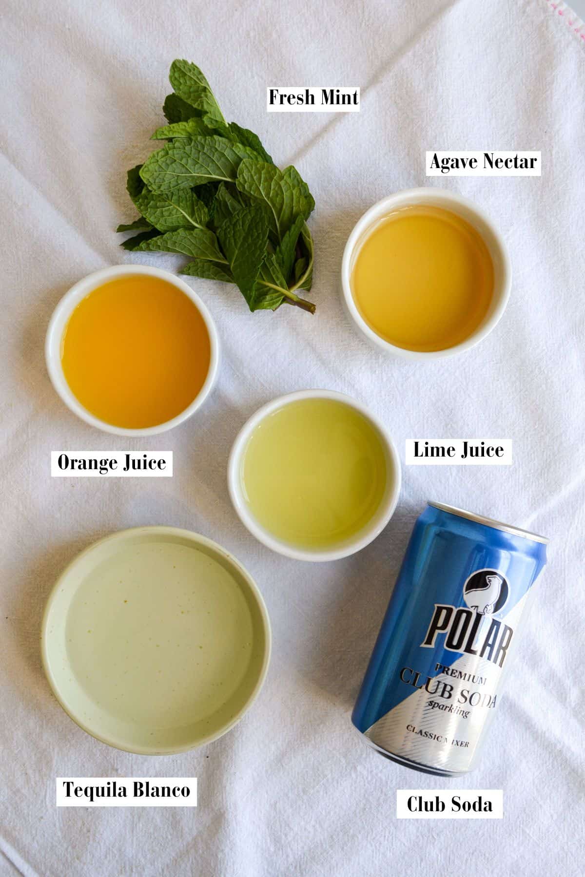 Ingredients for this recipe in small bowls on a linen surface.