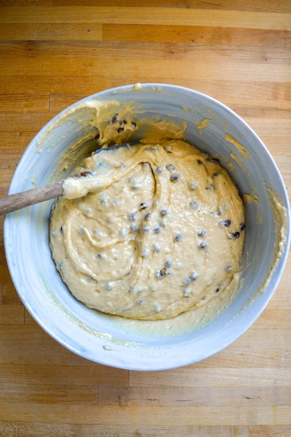 Chocolate chip muffin batter in a mixing bowl.