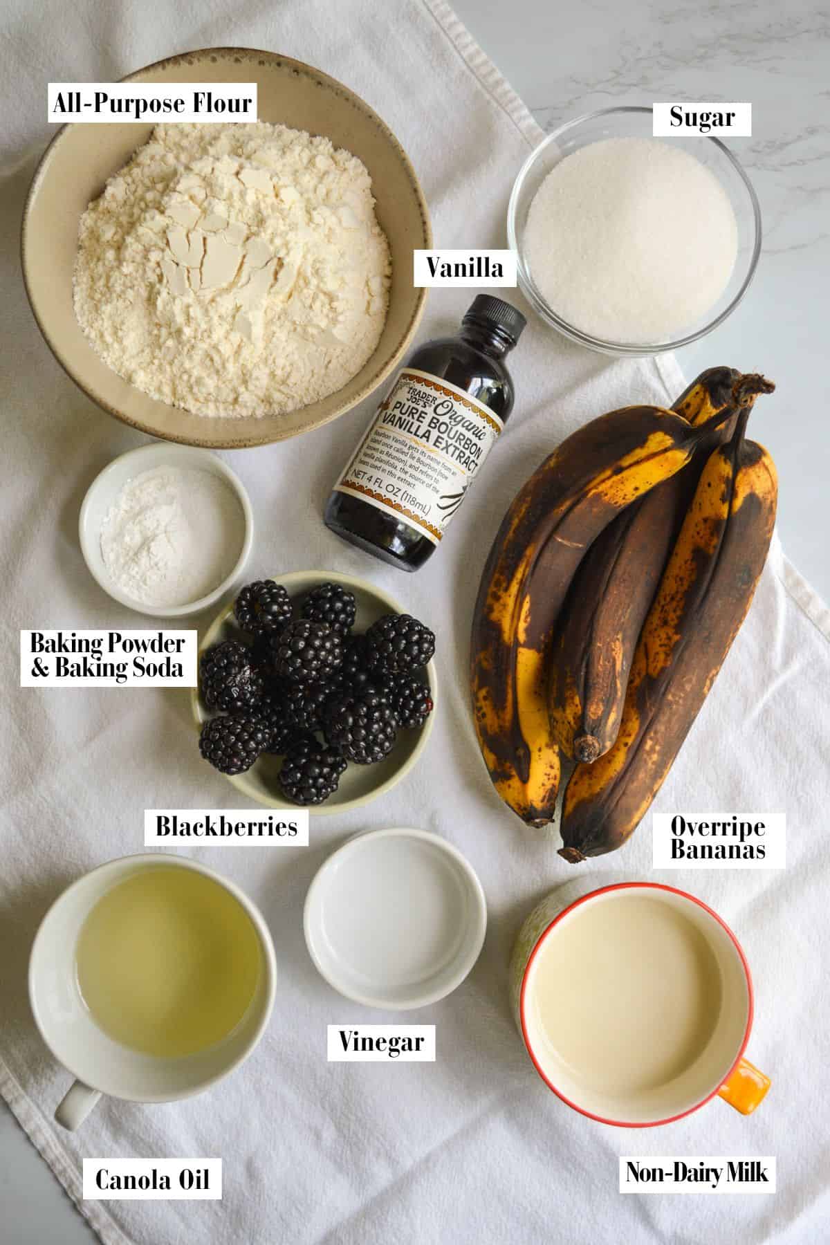 Ingredients for making this recipe in small bowls on a linen surface.