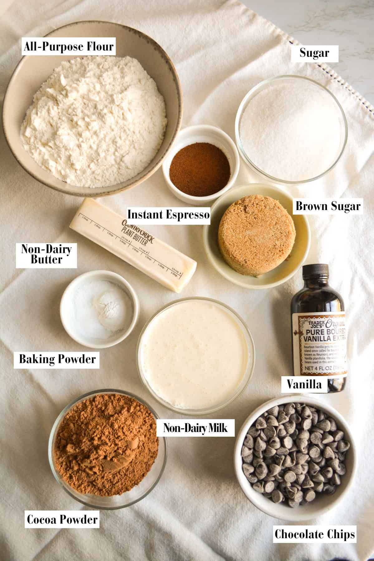 Ingredients for this recipe in small bowls on a linen surface.