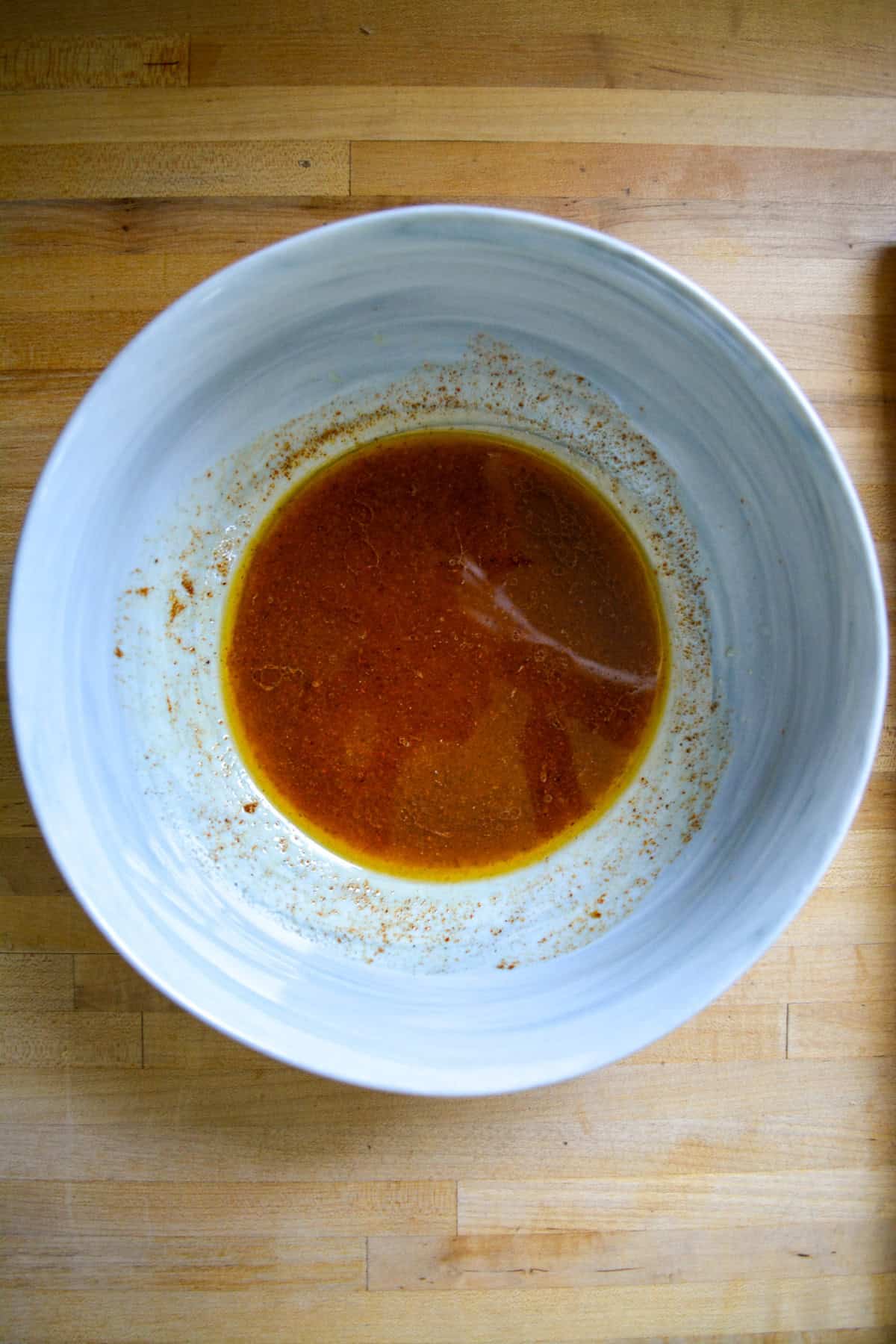 Slaw dressing in a large mixing bowl.