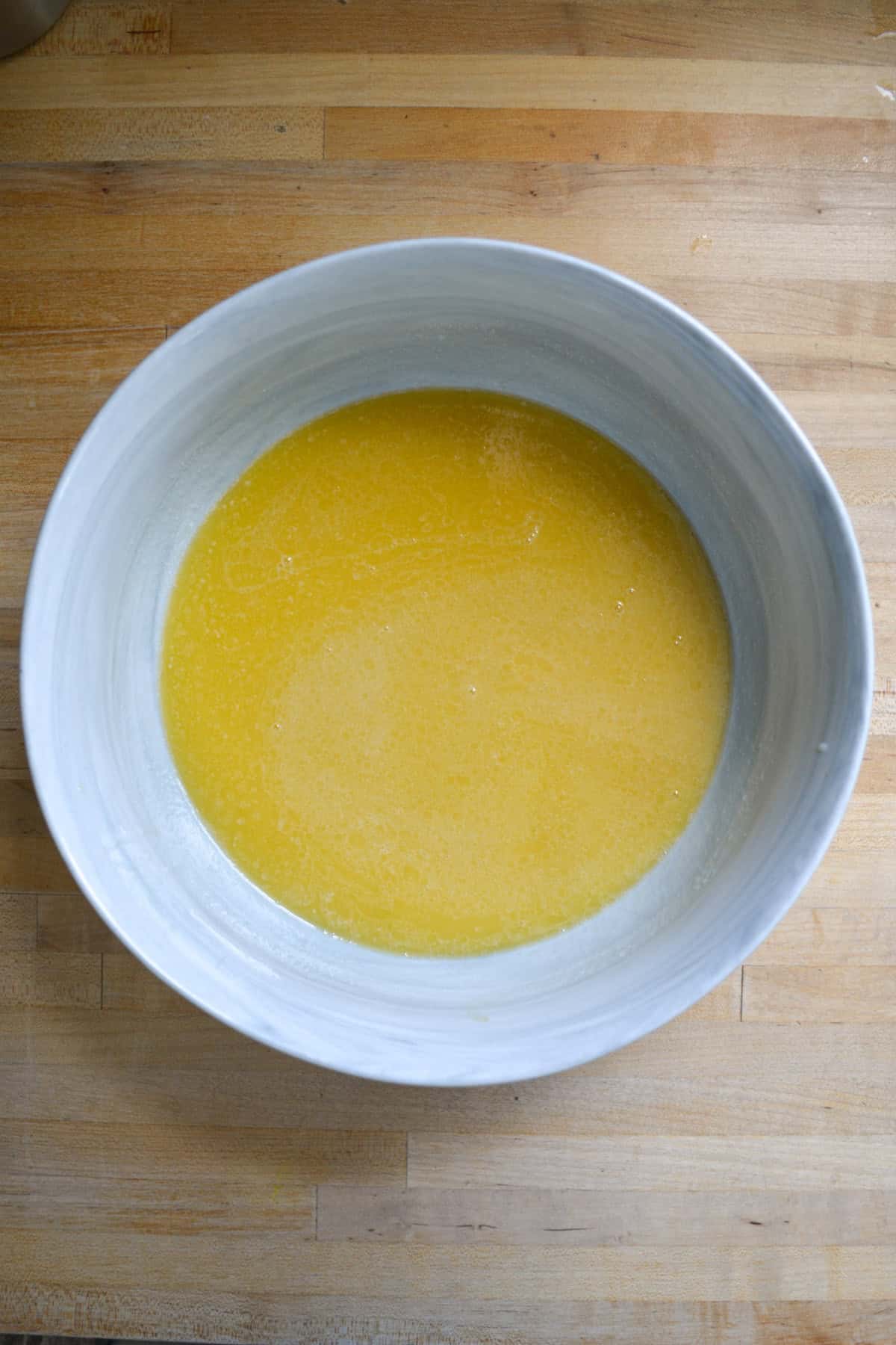 Wet ingredients for the cake batter in a large mixing bowl.