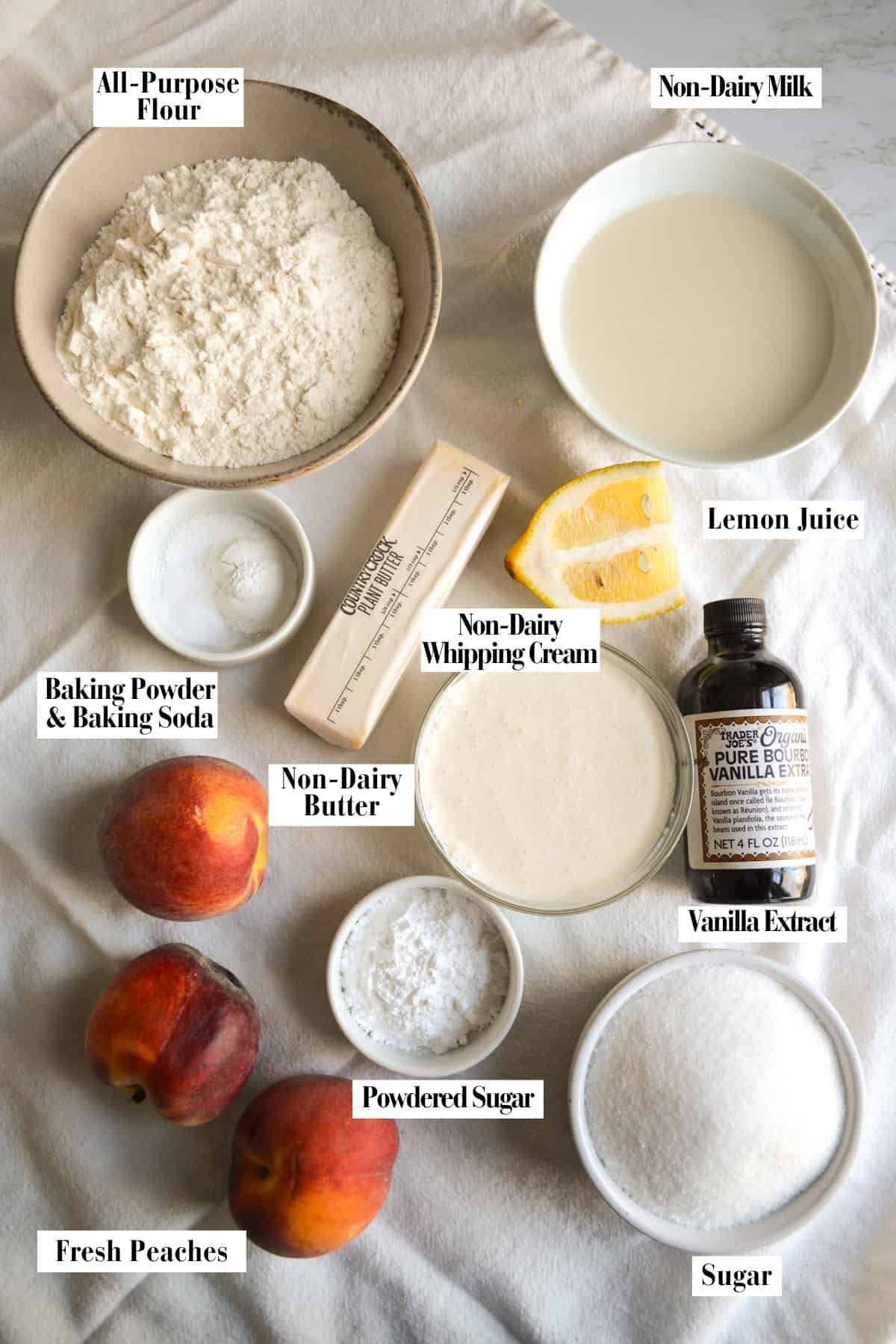 Ingredients for making this recipe in small bowls on a linen surface.