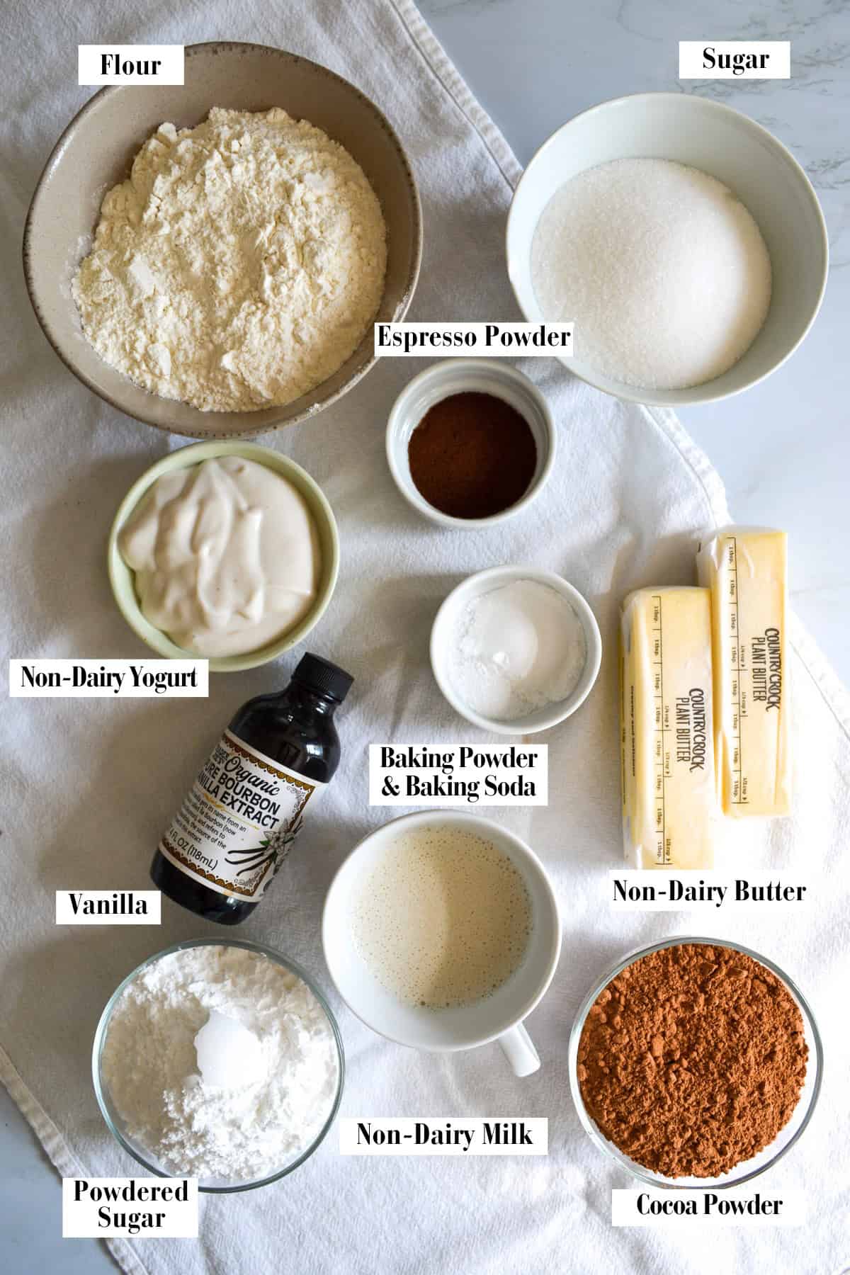 Ingredients for this recipe in small bowls on a linen surface.