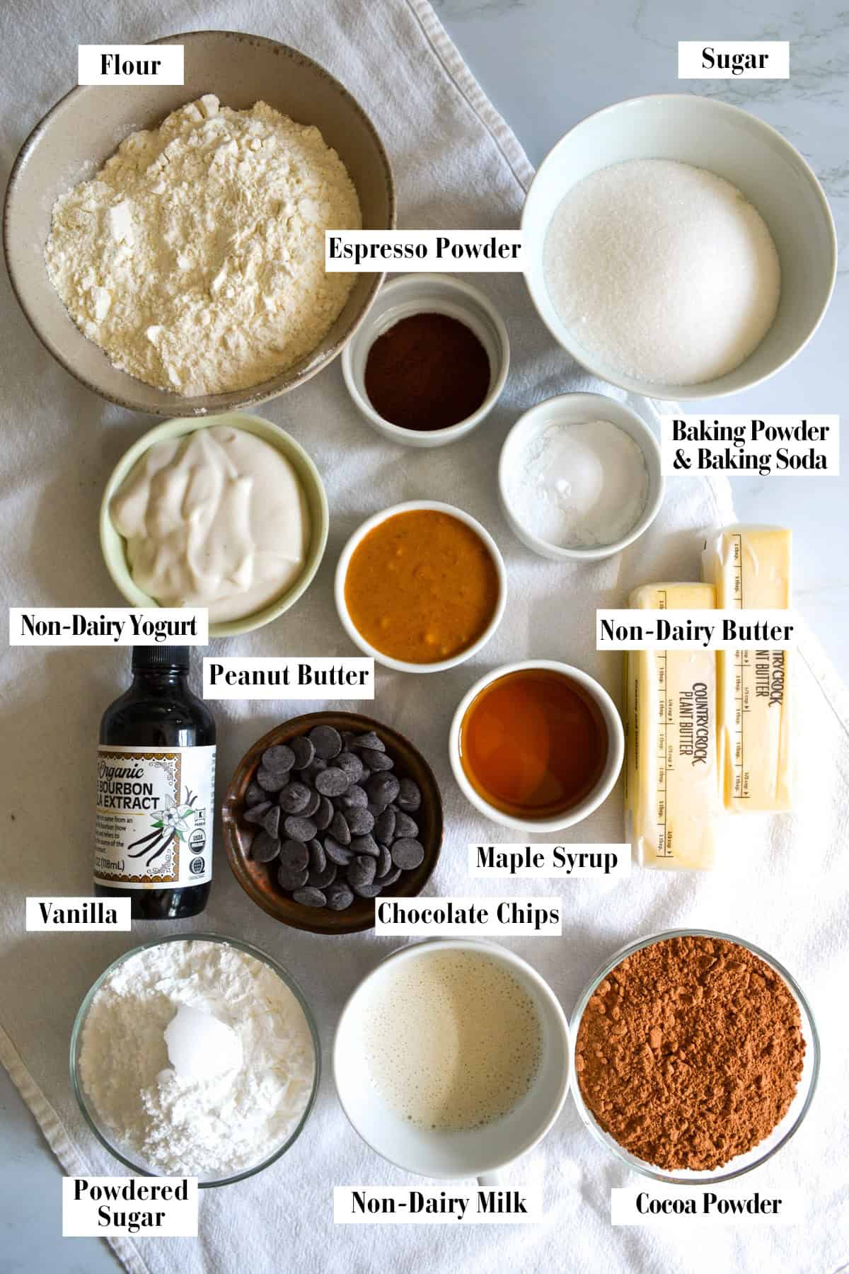 Ingredients for this recipe in small bowls on a linen surface.