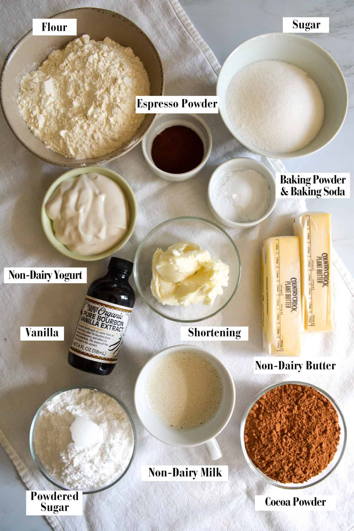 Ingredients for making this recipe in small bowls on a linen surface.